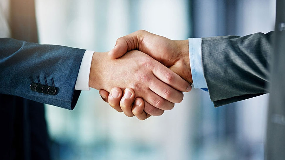 client and a lawyer shaking hands after creating an asset protection trust