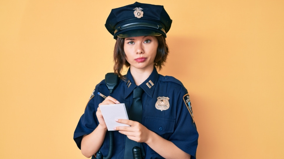 a police woman writing about gun rules