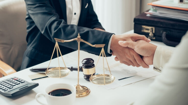 a colorado trust attorney handshaking with his client