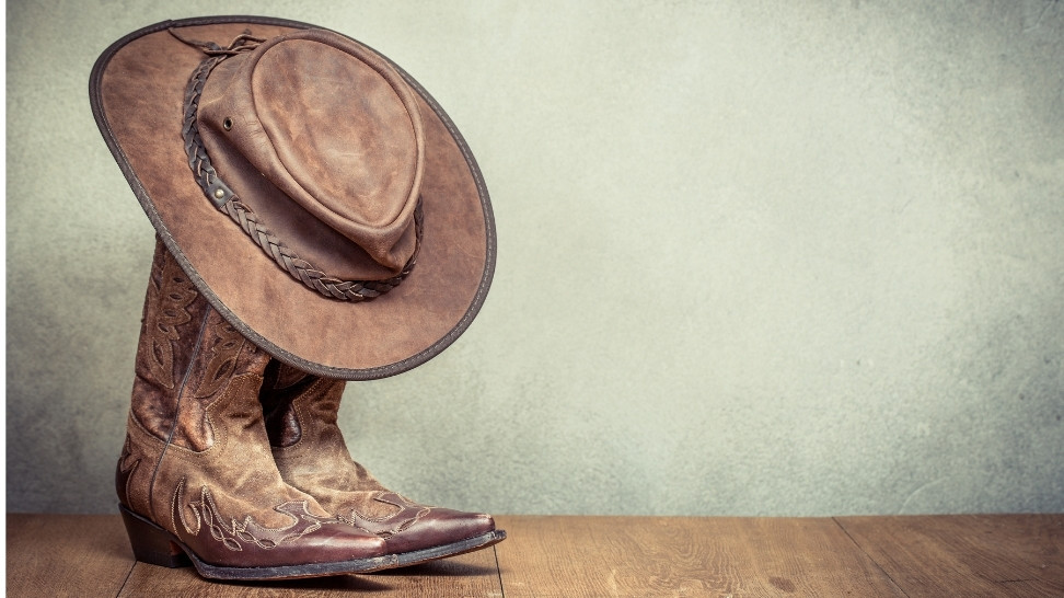 boots and hat of a cowboy