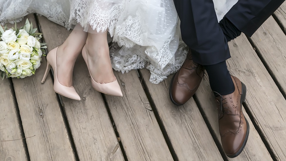 feet of a bride and groom
