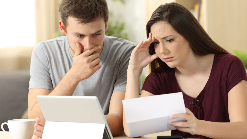 worried couple reading a letter from their trust protector