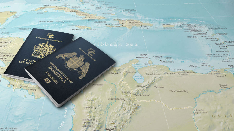 passports of two caribbean states on map of caribbean sea