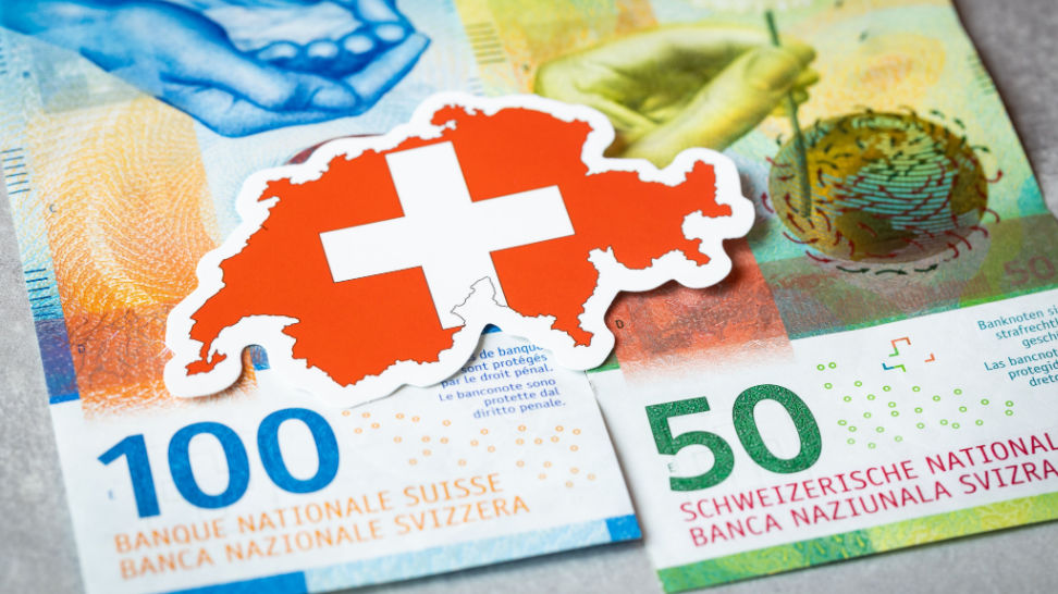 swiss flag on swiss currency background