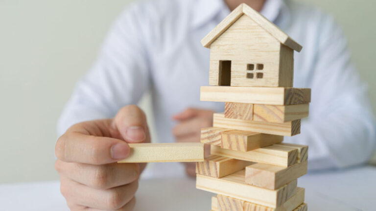 wooden model house on a wooden blocks