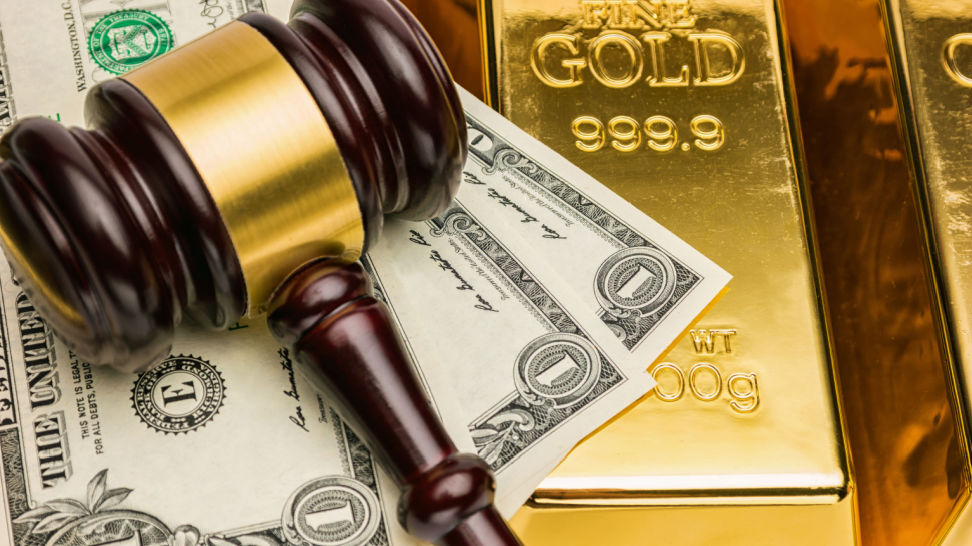 gold bars with us dollars and judge gavel
