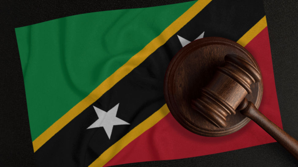 judge hammer and the flag of saint kitts and nevis