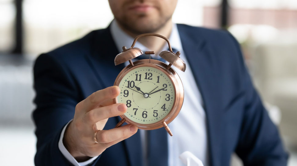 asset protection attorney holding clock showing time limit