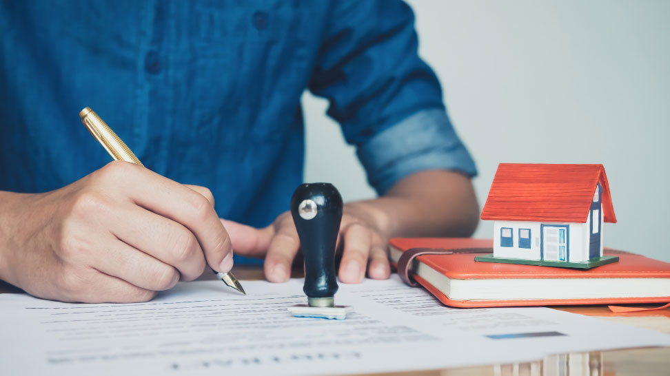 real estate investor signing documents