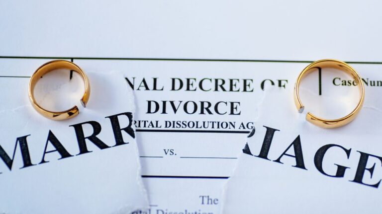 divorce decree and two broken wedding rings