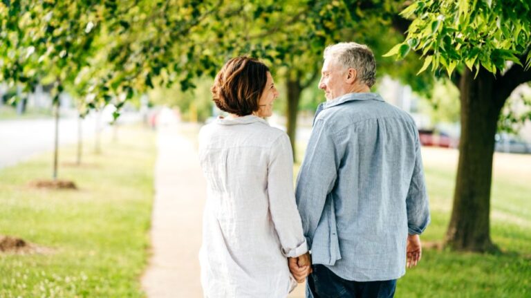 elderly couple walking on the street