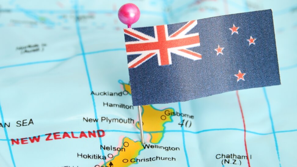 new zealand flag pinned in a map