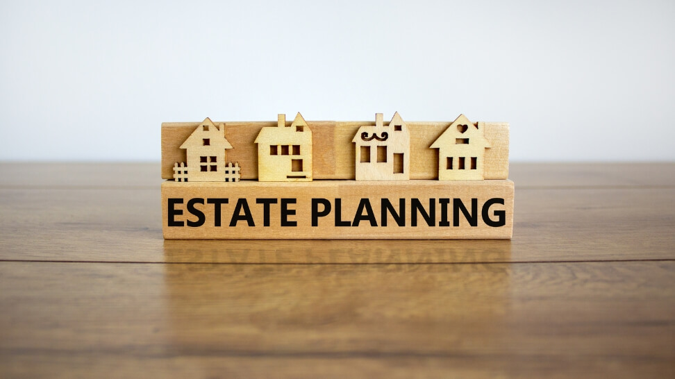 wooden blocks with written estate planning