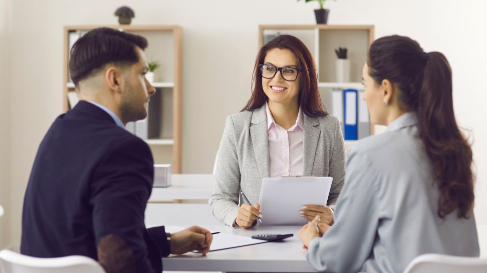 married couple meeting with a financial advisor