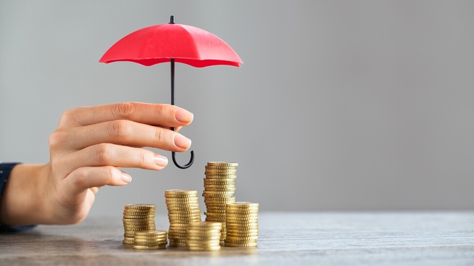 red umbrella on top of coins