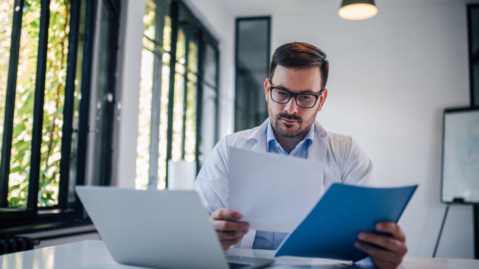 doctor reviewing documents