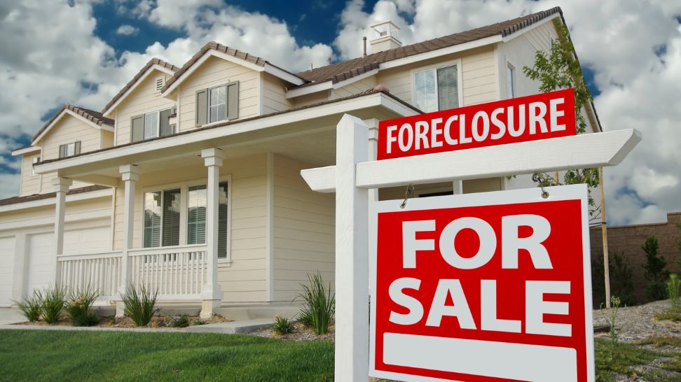 foreclosure for sale sign outside house