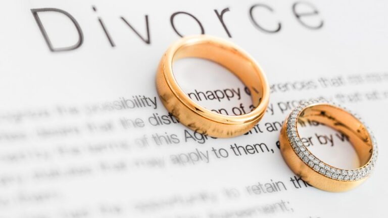 wedding ring on divorce paper